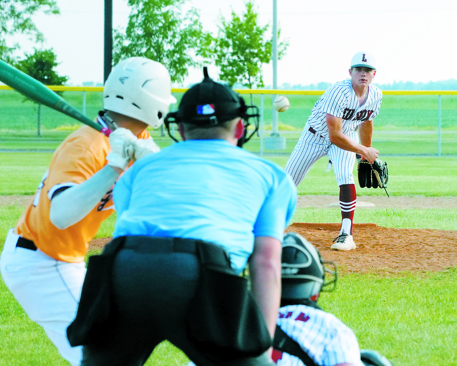 Nic Kingzett eyes the batter and send a strike over the plate against Grafton. Photo by Larry Stokke.