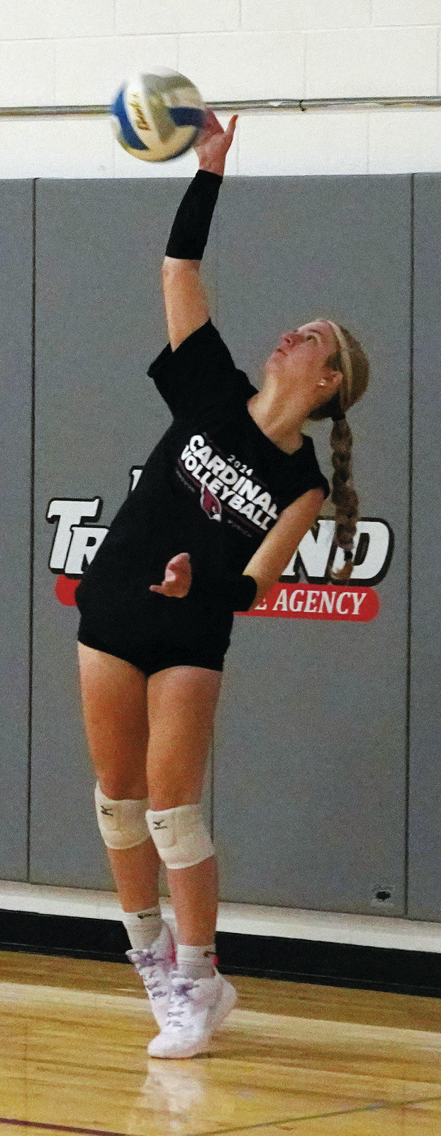 Hilary Haaven spikes the ball back over the net. Photo by Larry Stokke. Tallia Johnston serves up an ace. Photo by Larry Stokke.