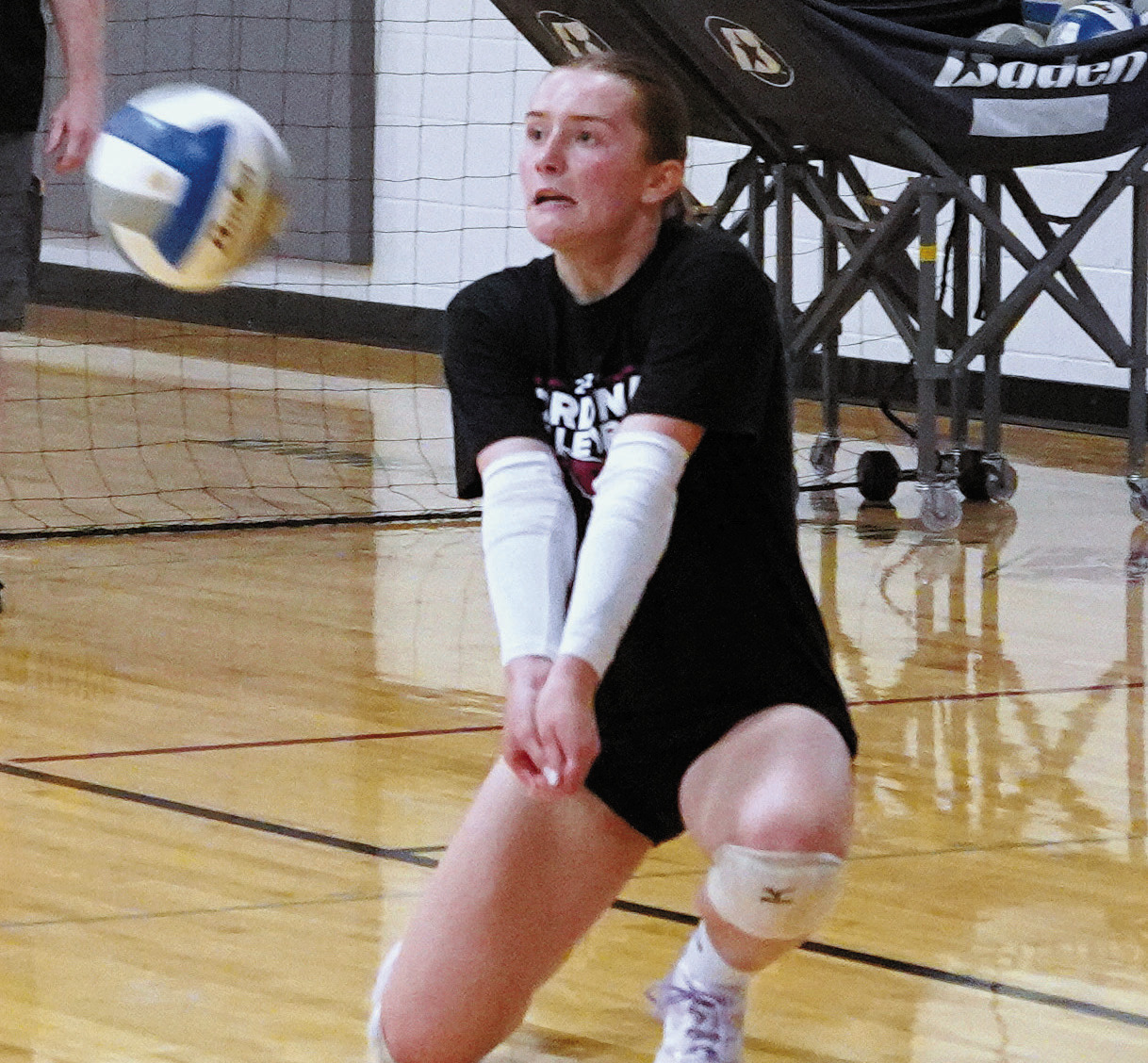 Meredith Romfo with a backrow dig. Photo by Larry Stokke.