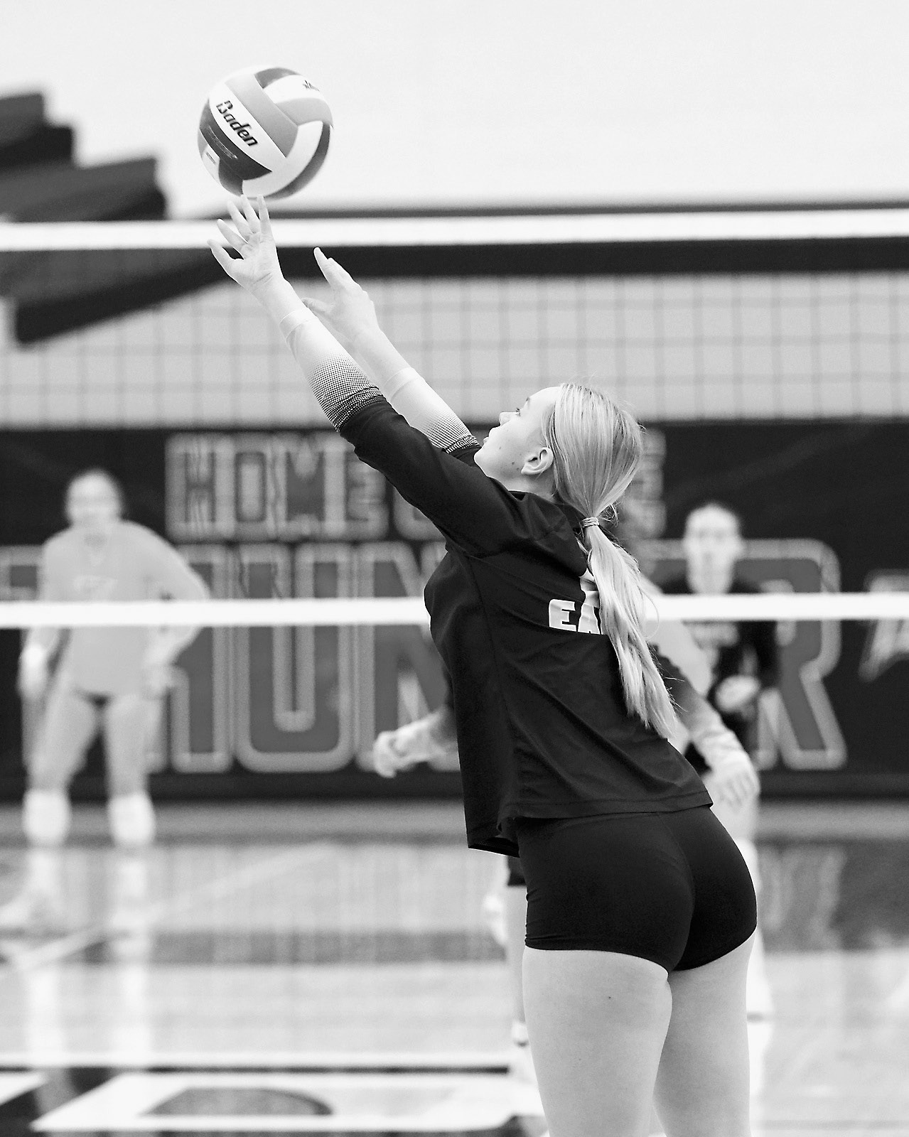Jacy Fraser passes the ball to a teammate in Park River at the district volleyball competition. Photo by Larry Stokke.
