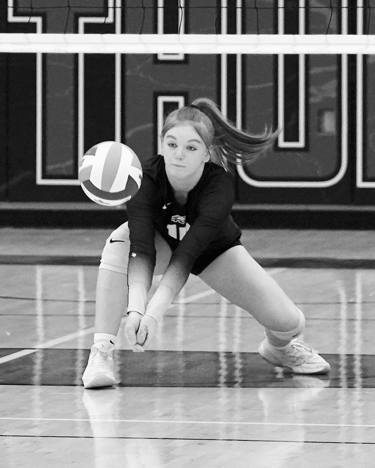 Marlie Stremick eyes the ball before digging it to the front row in the game against Park River on Oct. 30. Photo by Larry Stokke.