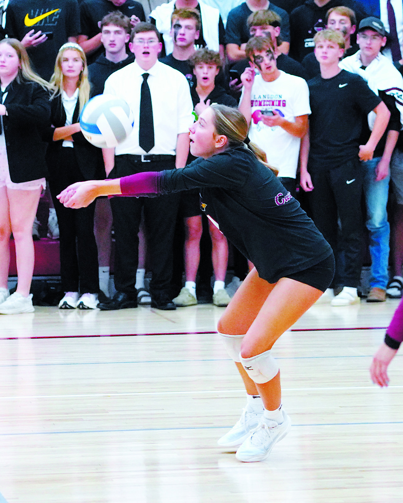 Meggy Hetletved with a backrow dig had 12 for the game against the Spoilers. Photo by Larry Stokke.