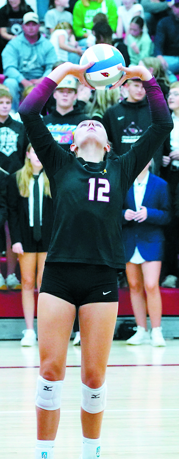 Kemi Morstad sets the ball, finishing the game with 32 assists. Photo by Larry Stokke.