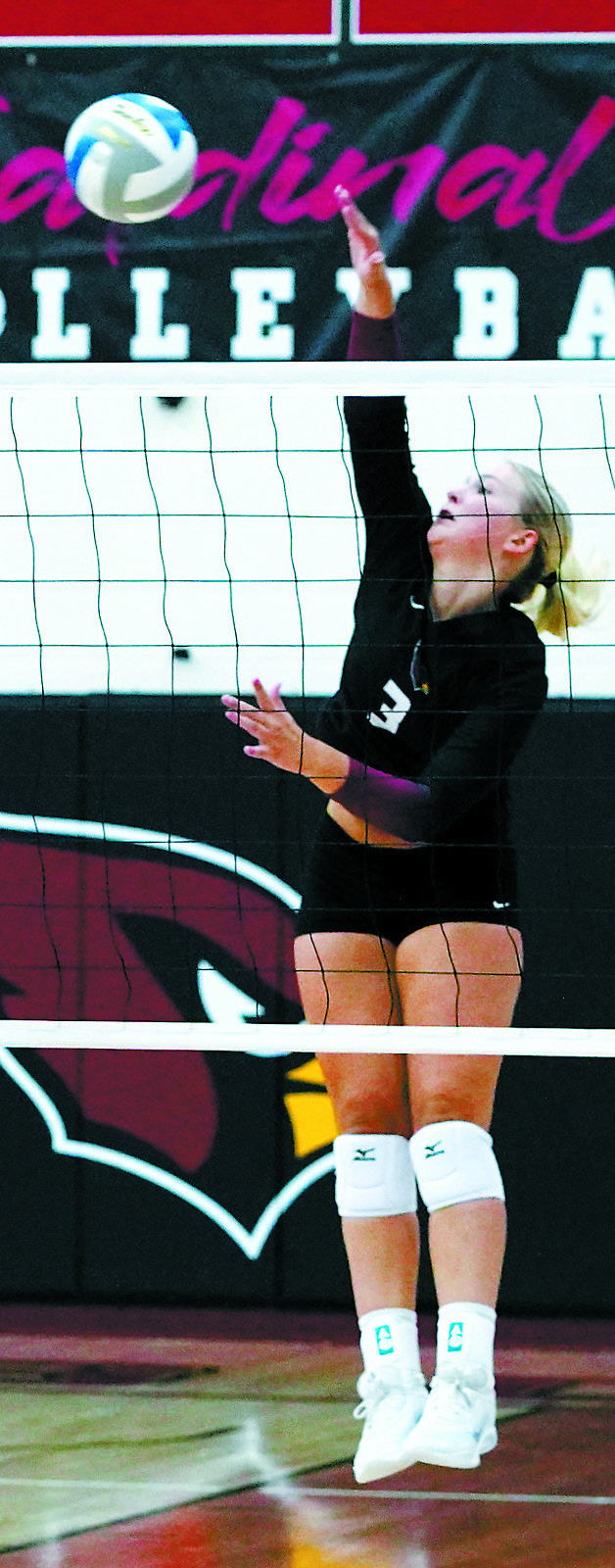 Emma Hall sends the ball back over the net for a kill against the Spoilers. Photo by Larry Stokke.