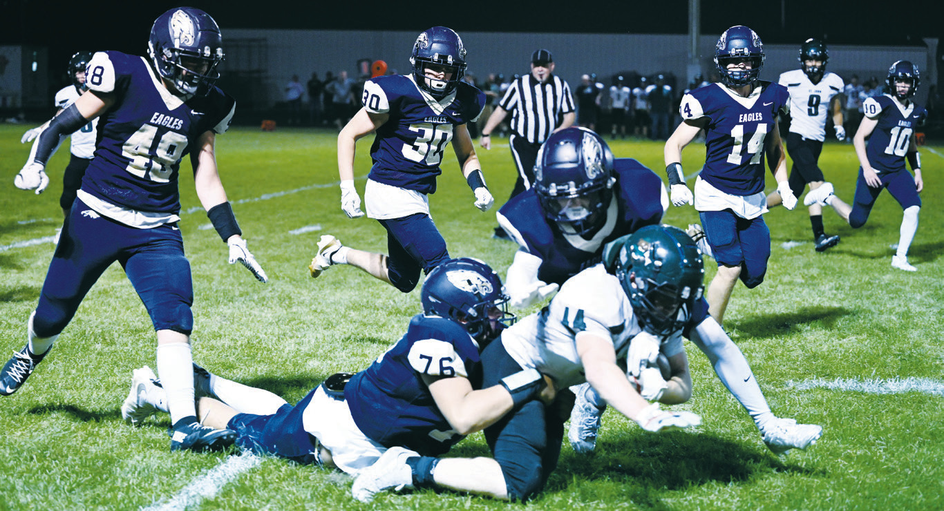 Cameron Saldana brings down a Woodchuck ball carrier in the North Border Eagles’ Homecoming game. Photo by Ashley Shafer.