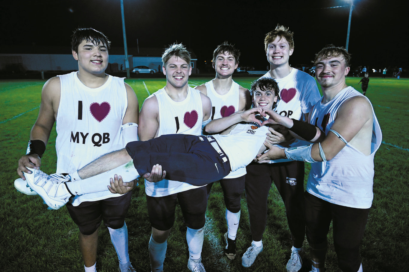The linemen showing some love for their quarterback after the big Homecoming game win on Sept. 26. Photo by Ashley Shafer.