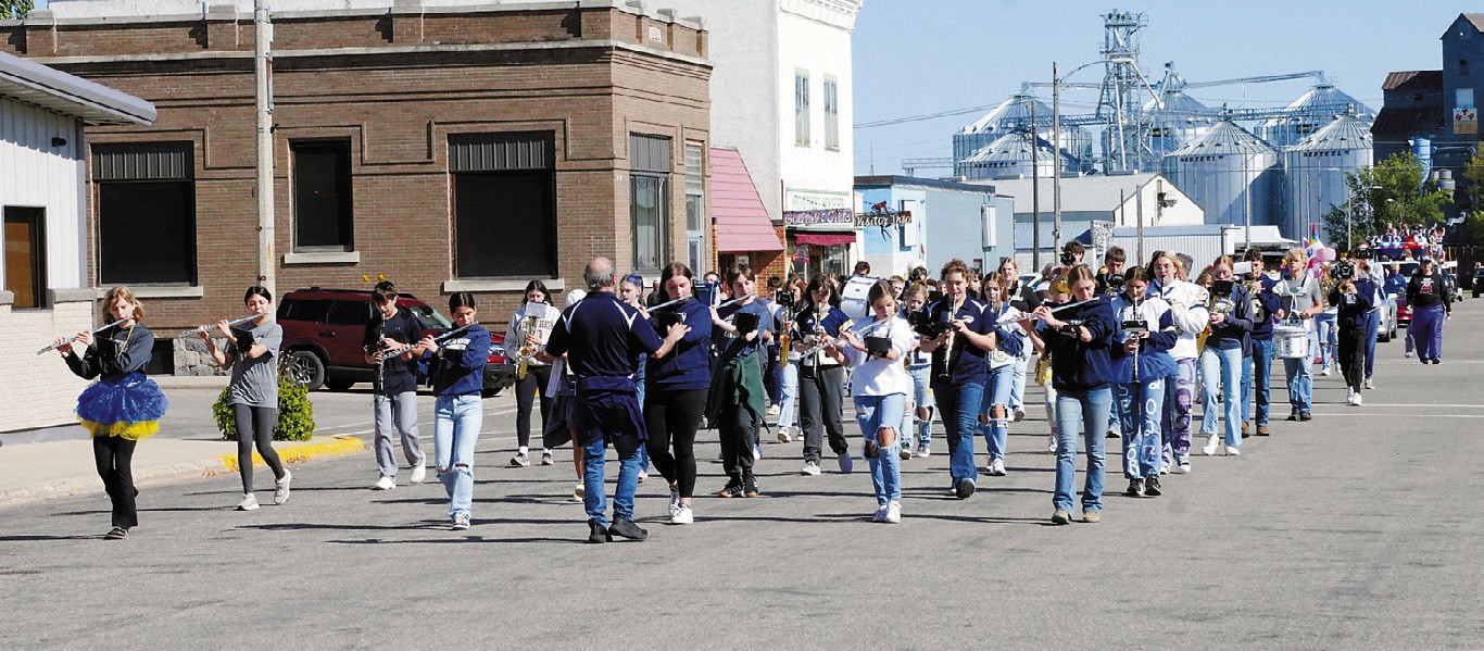 The North Border marching band takes to the streets to lead the homecoming parade. Photo by Larry Stokke.
