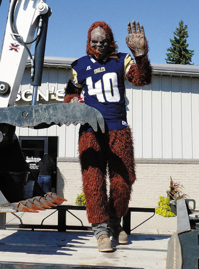 North Border's mascot waves at the camera in the Homecoming parade leading up to the big game. Photo by Larry Stokke.