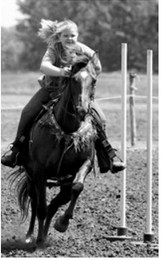 Jean Cook claimed first place in the pole bending race at the Sapa Arena Fun Day on June 7. Photo by Larry Stokke