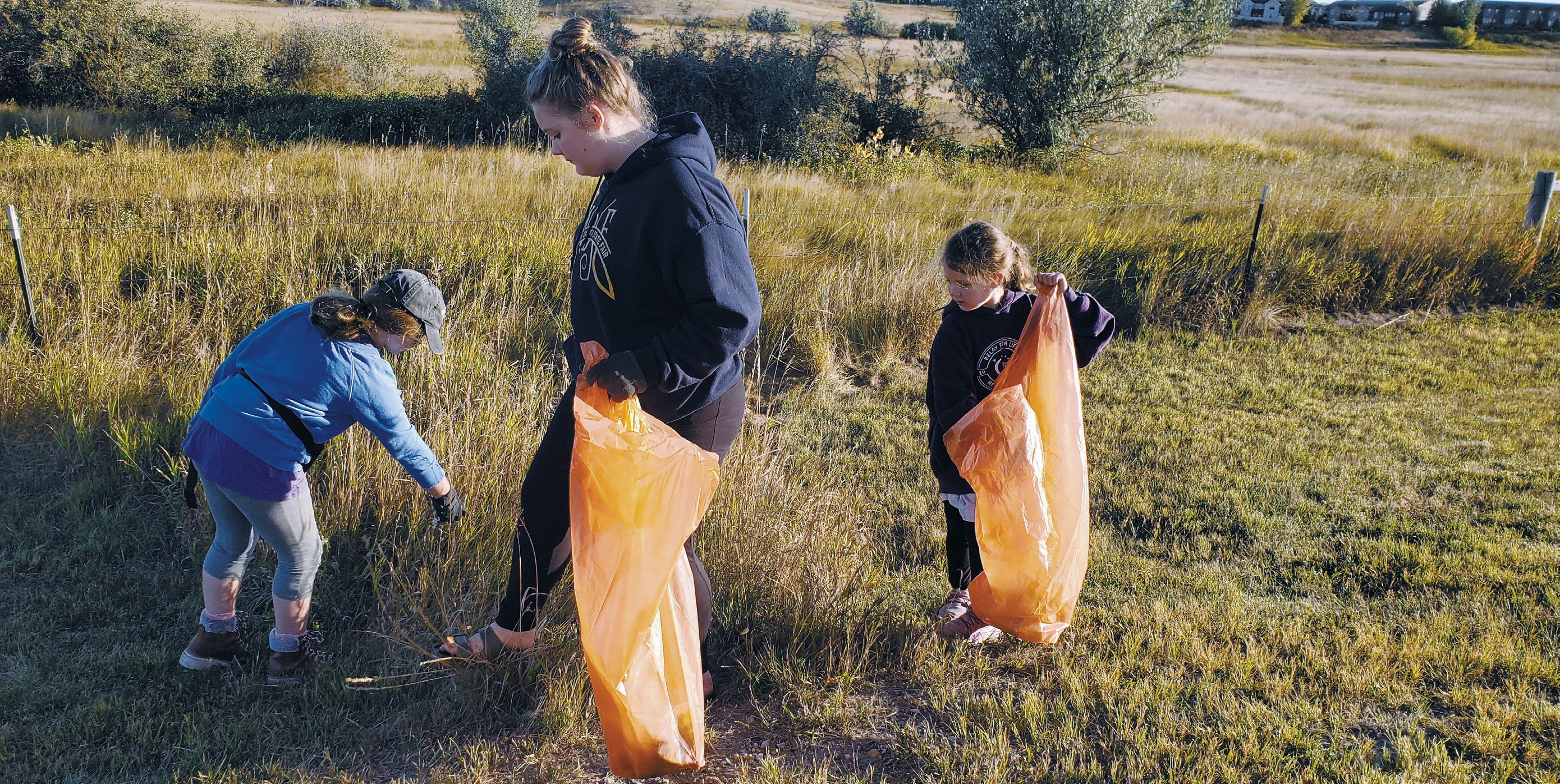 Members from the Clever Clovers 4-H Club in Williams County pick up trash for “Clean Williston,” a community service project for the Healthy North Dakota 4-H Club challenge. (NDSU photo)