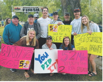 Jaxen Johnson, center, celebrates with family and friends after completing the 52-mile Bighorn Trail Run in Wyoming. Submitted photo
