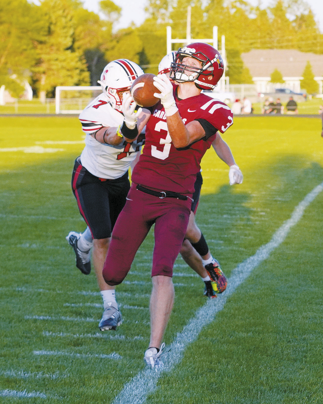 Cody Amble with a reception for a first down in the Cards first home game. Photo by Larry Stokke.