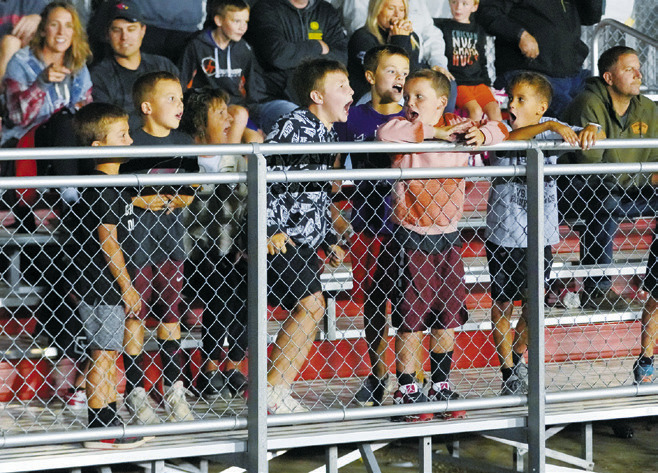 Some future Cardinals cheer on the boys at the first home game of the season. Photo by Larry Stokke.