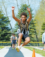 Trevor Moore finished 6th in long jump at 16'4.5'. Photo by Larry Stokke.