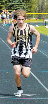 Cameron Kissiah running in the 100 meter dash in Larimore. Photo by Larry Stokke.