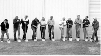 Officials, supporters and NDSU representatives take part in the ceremonial groundbreaking for the new seed cleaning facility during the Langdon Research Extension Center Field Day on July 16. The new facility will support seed research and crop improvement efforts at the Langdon REC. Photo by Larry Stokke