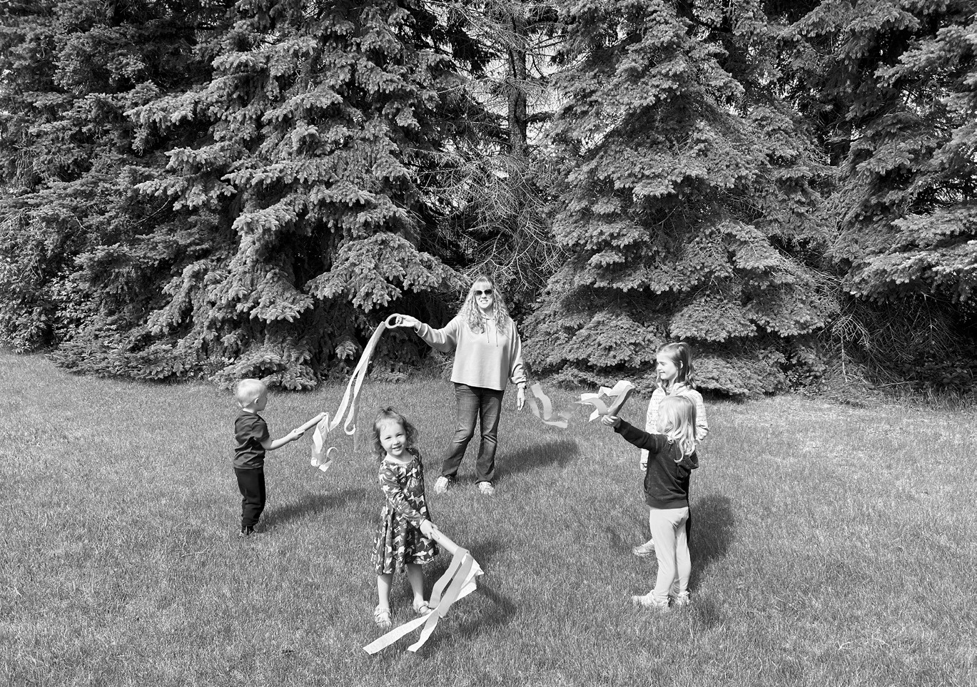 Children use colorful ribbons during a movement activity set to Latin music as part of Lisa Schuler’s summer music classes. The classes introduce young learners to music through movement, rhythm and hands-on activities.