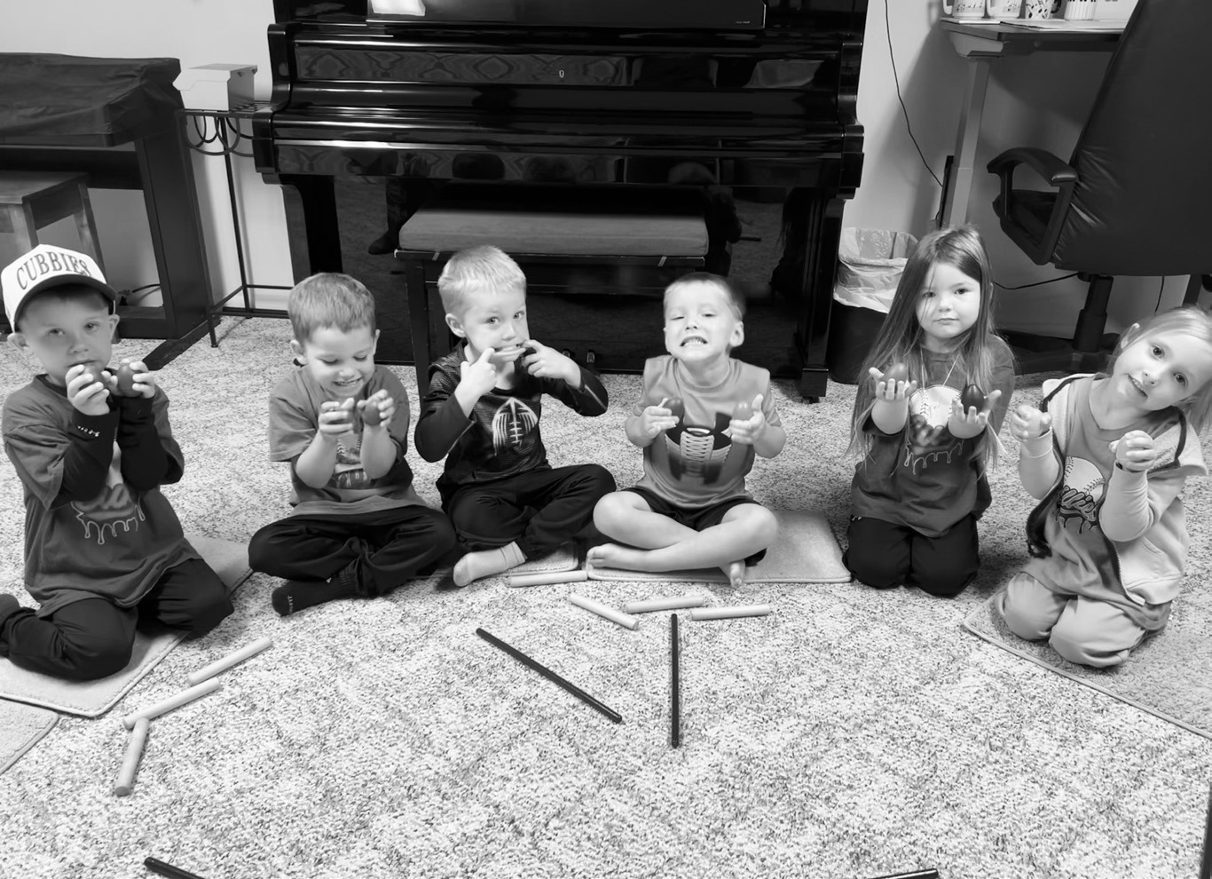 Children participating in Lisa Schuler’s summer music classes play egg shakers while listening to music by Wolfgang Amadeus Mozart. The classes introduce young learners to rhythm, movement and classical composers through hands-on activities.