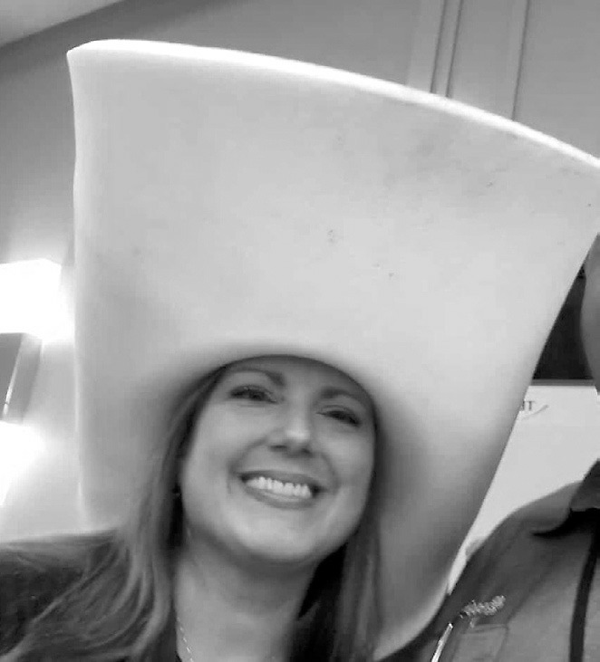 Heather in her giant yellow cowboy hat.