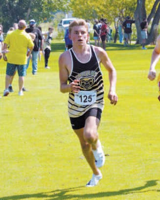 Pembina County North’s Grizzly Nash Fitzsimonds ran to an 8th place finish at the HCV Meet on Aug. 24. Photo by Larry Stokke