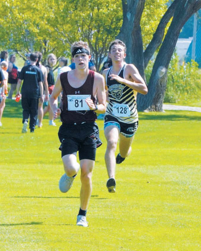 Cardinal Noah Foster followed by Pembina County North’s Mason Heller at the HCV Meet. Photo by Larry Stokke.