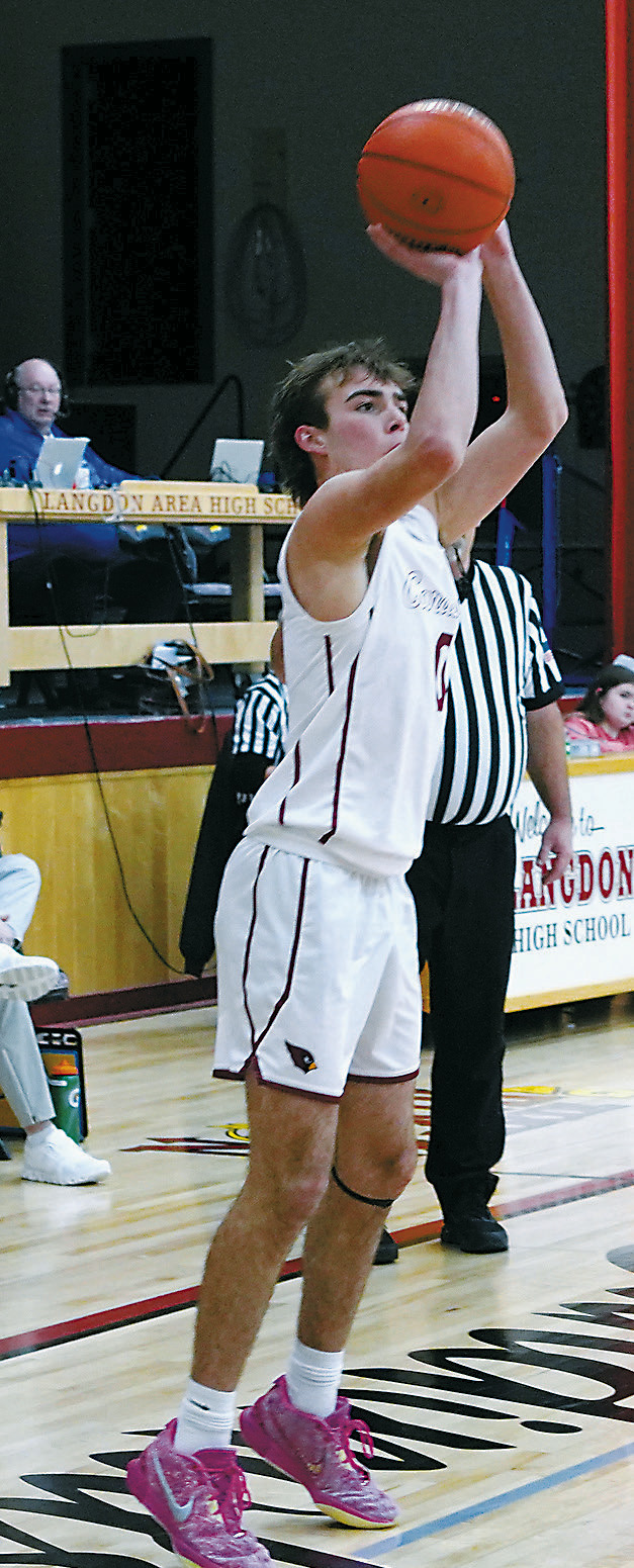 Jayden Lee added a couple 3-point baskets in the Cards’ win at home over the Tornadoes. Photo by Larry Stokke.
