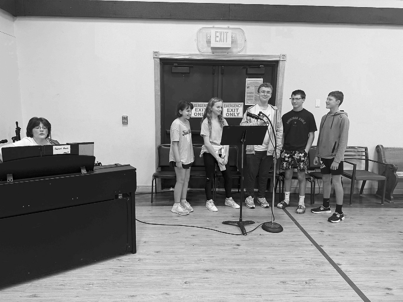 Members of our 6-8th grade choir continued to share music while Mass was held in our gymnasium. The choir is under the direction of Mrs. Becky Tollefson.