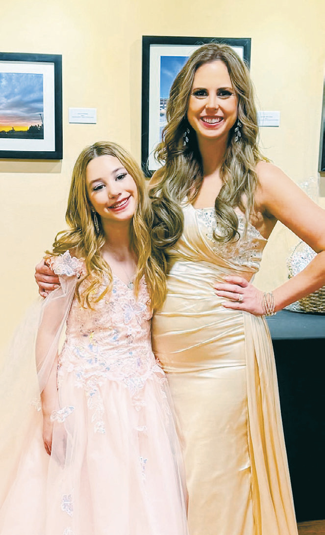 Isla and Tara competing in a pageant together.