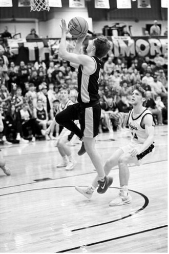 Kolter Kakela speeds ahead of the defense for a layup. Photo by Ashley Schafer