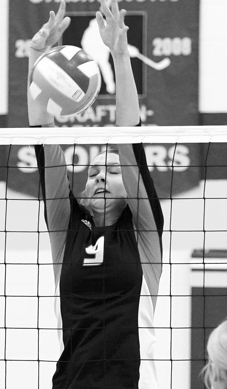 Jocelyn Anderson with one of her seven kills against Mayport C-G in Grafton on Nov. 11. Photo by Larry Stokke.