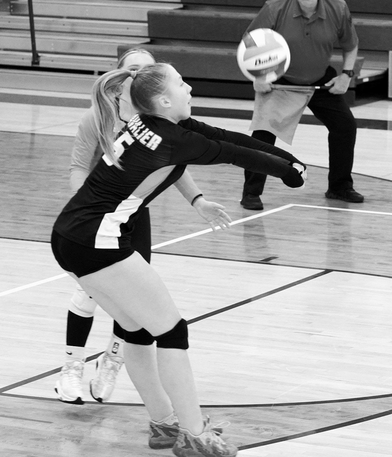 Katy Jensen had 11 digs against the Patriots during the Regional Tournament. Photo by Larry Stokke.