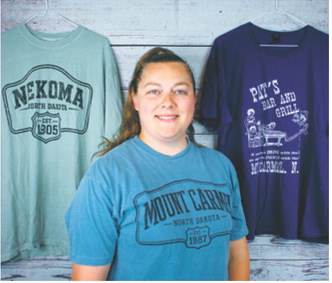Hanna Schneider, Hanna’s Baked Goods &amp; More, Langdon, offers occasional baked goods and shirt designs inspired by local communities. Submitted photo