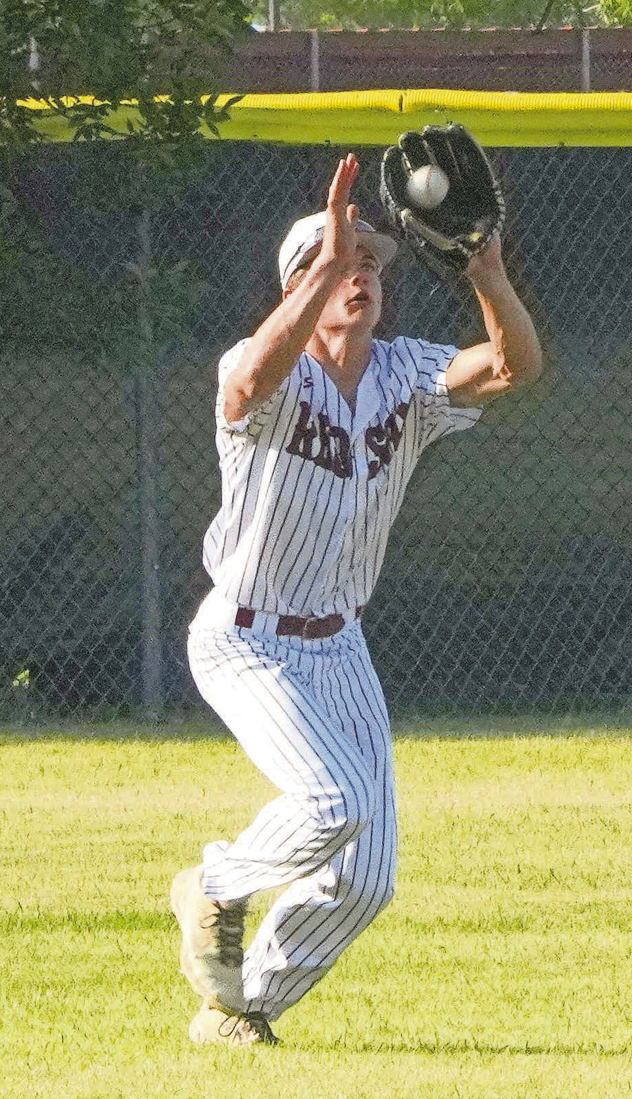 Nic Kingzett makes a catch for a third out in the win over Midway/Minto. PHOTO BY LARRY STOKKE.