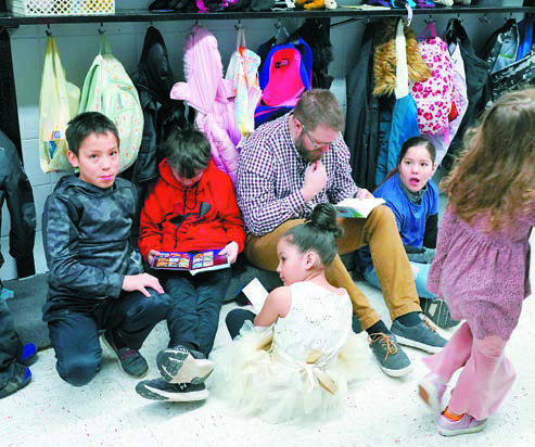 Students spending time reading for National Reading Month. Photo by Larry Stokke.