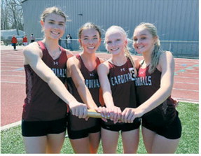 Members of the Langdon Area Cardinals 4x800-meter relay team — Taya Feist, Olivia Lorenz, Mya Swanson and Hallie Overby — celebrate after qualifying for the state meet at the Grizzly Invite on April 20 in Grand Forks with a time of 10:18.97.