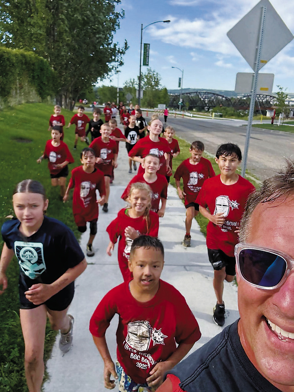 Tanner Schweitzer (front) leads youth participants along the route of the Medieval Rush in early August 2025 on a route near Bismarck State College. Photo provided by Tanner Schweitzer.