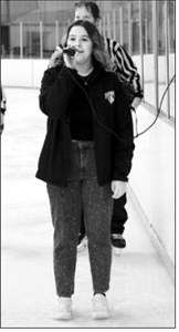 Madelyn Crump sang the National Anthem for the last time at the start of the games. Her beautiful singing at the start of sports games will be missed. Photo by Larry Stokke