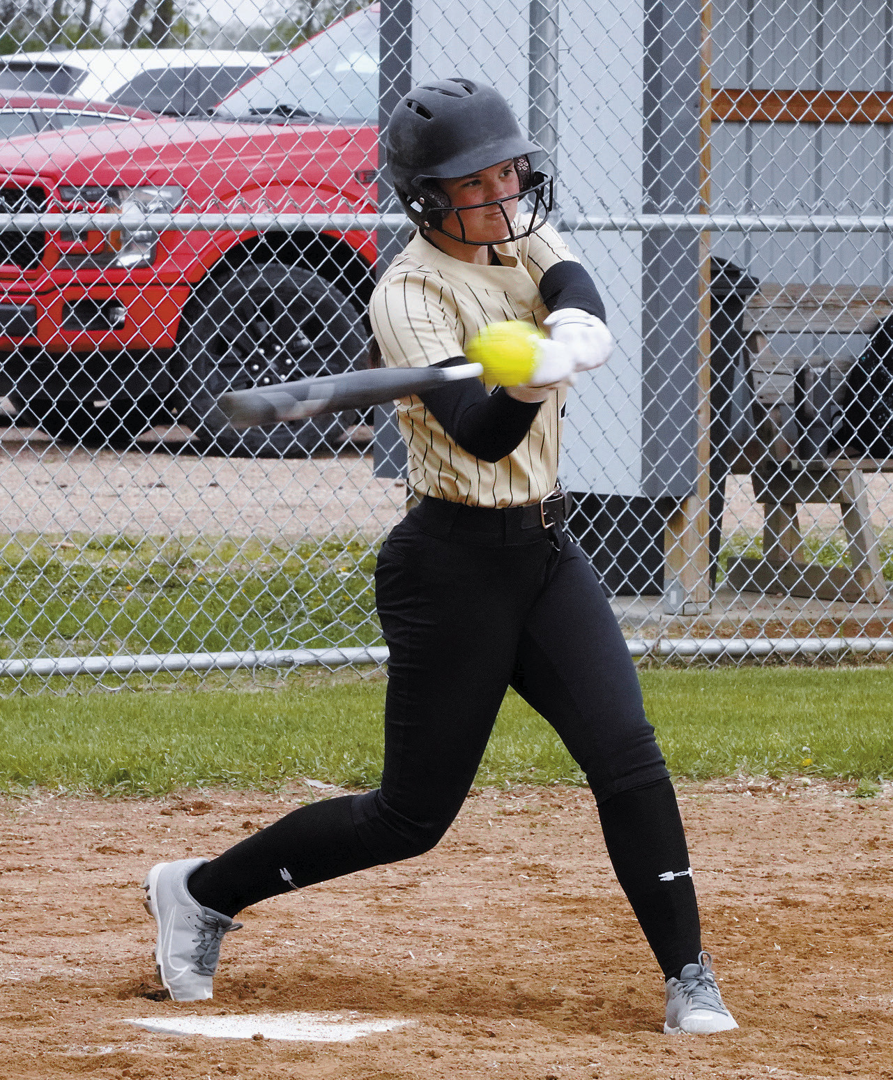Avery Sondeland connects for a base hit in Cavalier against Nelson County. Photo by Larry Stokke.
