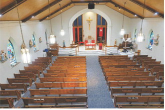 The sanctuary of St. Alphonsus Catholic Church is pictured following interior renovations completed last year. The project included updates designed to brighten and enhance the worship space.