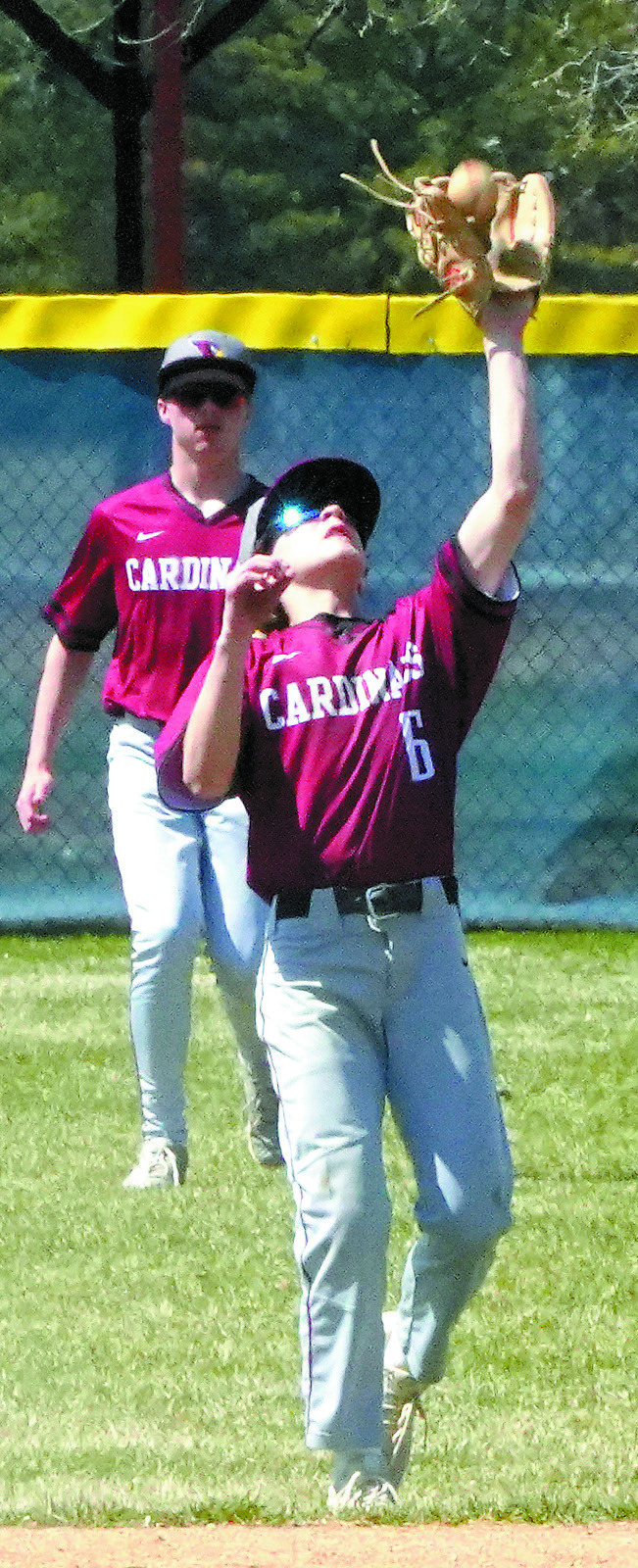 Connor Mitchell gloves a flyball for a third out against NRS. Photo by Larry Stokke.