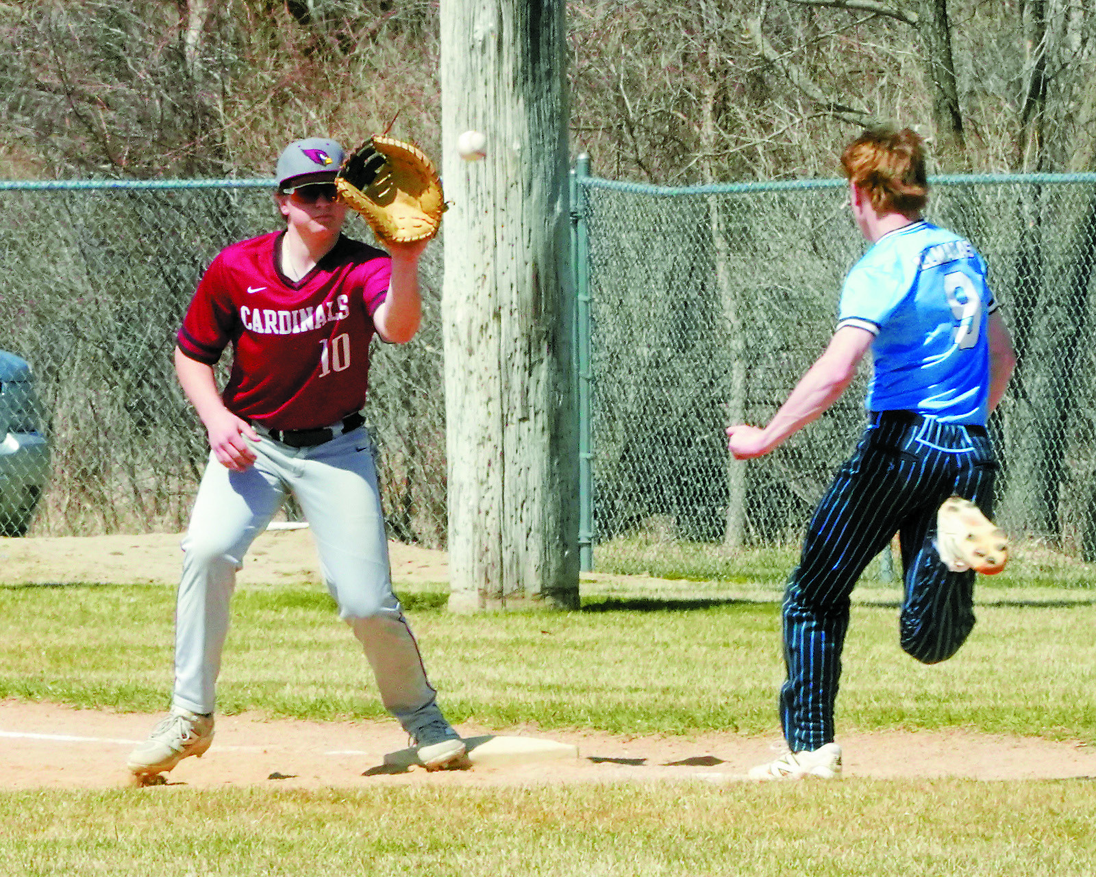 Devin Hakanson waits for the ball and puts out a NRS player at first base in New Rockford on April 25. Photo by Larry Stokke.