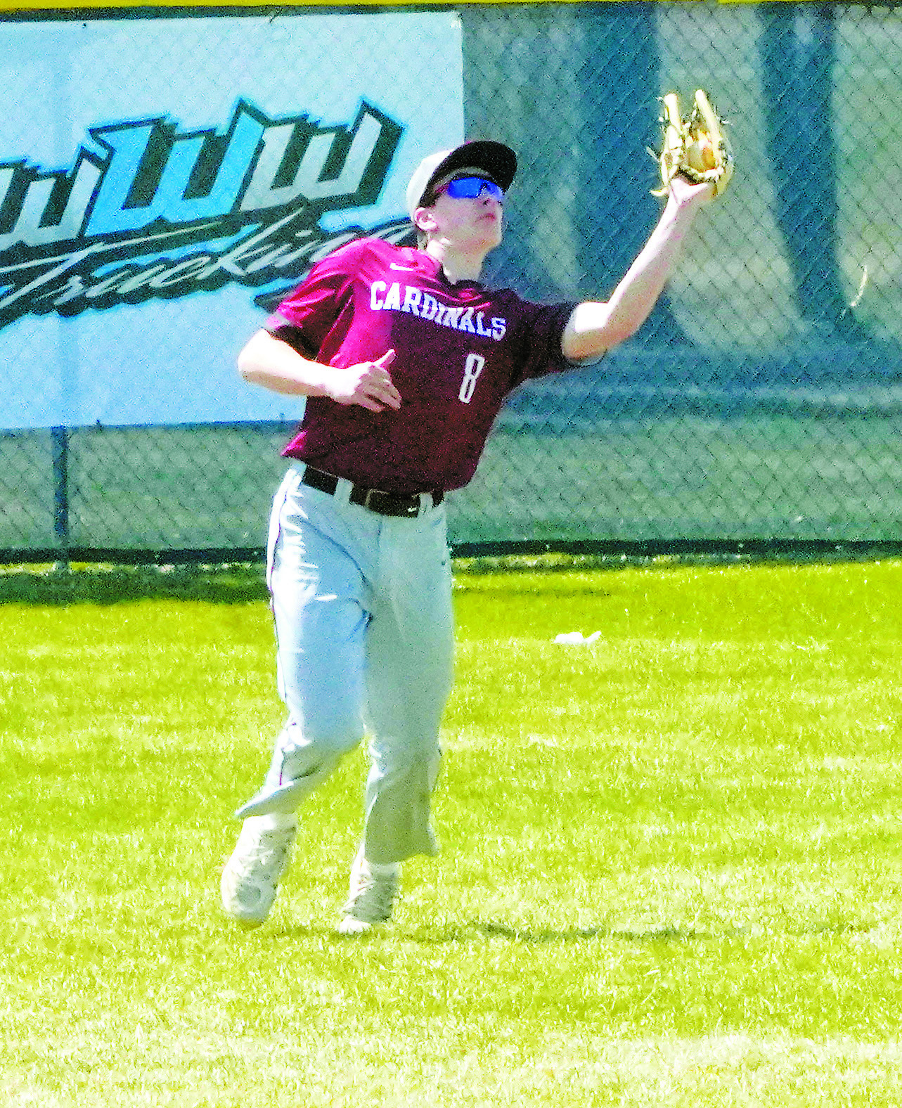 Eastyn Schaefer with a catch deep in center field during the win over NRS on April 24. Photo by Larry Stokke.
