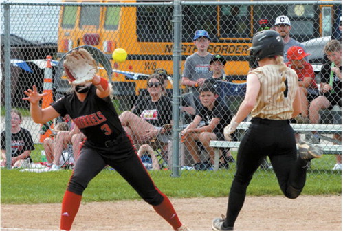 Pembina County North's Remi Larson beats the throw to first base during the Grizzlies' state tournament matchup against Central Cass. Photo by Larry Stokke