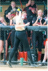 Pembina County North's Jocelyn Anderson makes a catch for an out near the Central Cass dugout during action at the state softball tournament. Photo by Larry Stokke