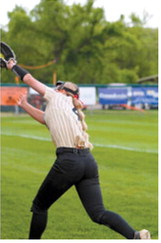 Colbie Furstenau reaches up near the thirdbase fence to make a difficult catch for an out during the Grizzlies' game against Glenburn. Photo by Larry Stokke