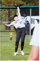 Hadlee Mortensen settles under a fly ball and makes the catch in deep right field for an out during the Grizzlies' game against the Glenburn Panthers. Photo by Larry Stokke