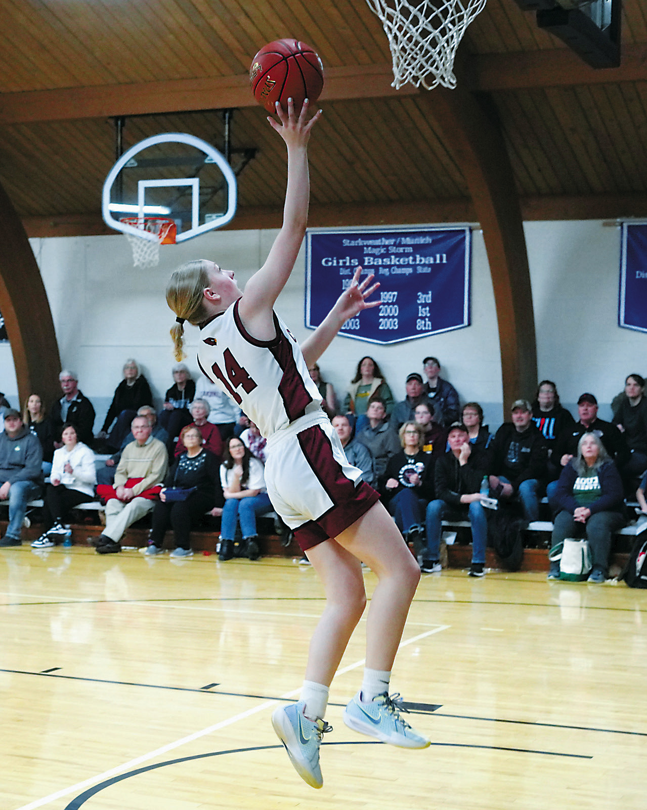 Hilary Haaven lays in a right hand layup against the Benson County Wildcats in Munich on Jan. 3. Photo by Larry Stokke.