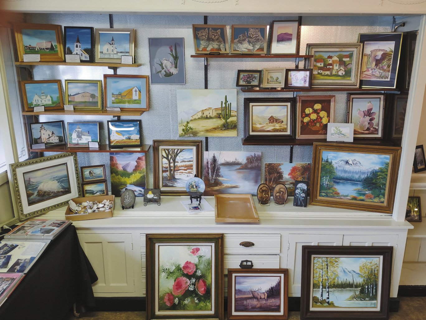 The silent auction space features a variety of art works donated by Leo Beauchamp and the family of Adeline Belanus for this year’s event.