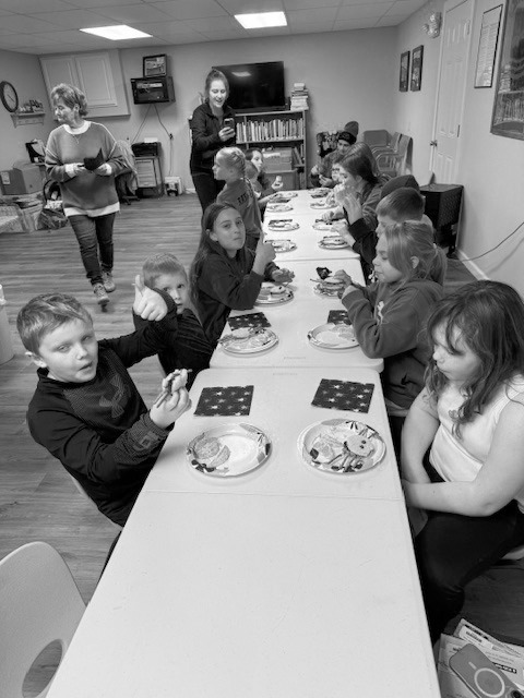 Kids enjoying their snacks at Story Hour.