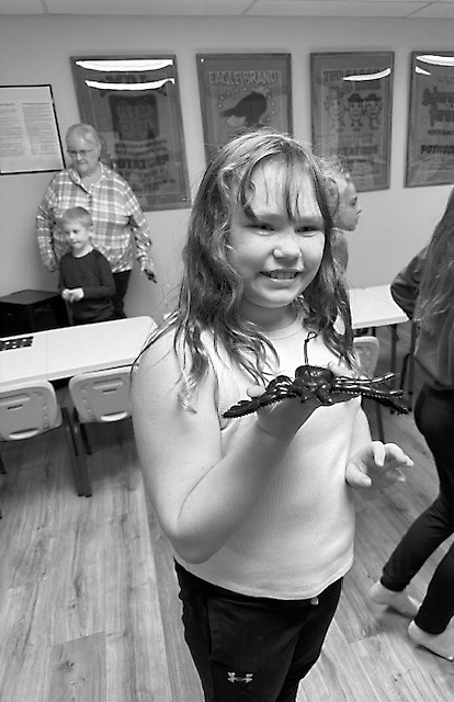 Danika Blair shows off a spider she created after Story Hour at Walhalla Public Library.